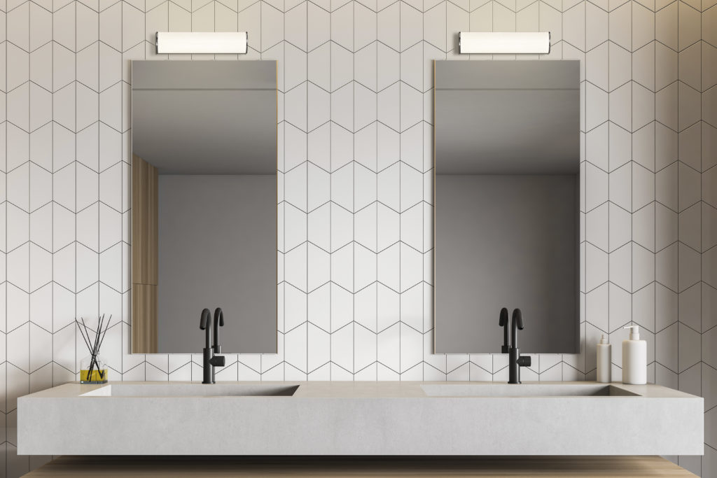 White tile bathroom interior with double sink