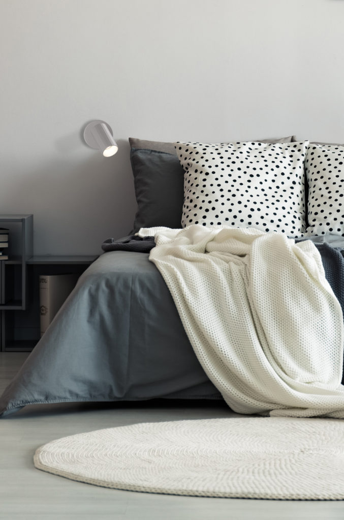 Vase,On,Metal,Table,And,Grey,Lamp,In,Spacious,Bedroom