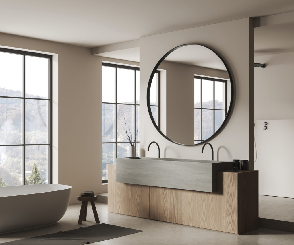 Light bathroom interior with bathtub and sink, mirror and panoramic window